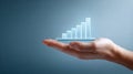 Hand holding digital bar chart showing business growth Royalty Free Stock Photo