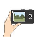 Hand holding digital camera with screen Royalty Free Stock Photo
