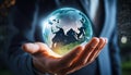 Hand holding digital globe surrounded by network connections