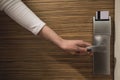 A hand holding door handle with modern keycard electronic lock Royalty Free Stock Photo