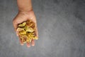 Hand holding dried fig fruit on a gray surface Royalty Free Stock Photo