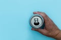 Hand holding drinks can on blue background Royalty Free Stock Photo