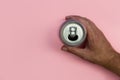 Hand holding drinks can on pink background Royalty Free Stock Photo