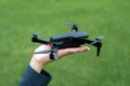 A hand holding a drone in the palm Royalty Free Stock Photo