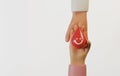 Hand holding a drop of blood with a smiling face giving it to recipient