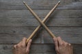 Hand holding drum stick on black table background Royalty Free Stock Photo