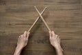 Hand holding drum stick on black table background Royalty Free Stock Photo