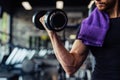 Hand holding dumbbell.Close up.Muscular arm in the gym. Royalty Free Stock Photo