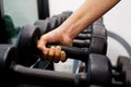 Hand holding dumbbell in fitness or gym. Muscle, exercise and lifestyle. Royalty Free Stock Photo