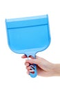 Hand holding dustpan Royalty Free Stock Photo