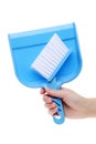 Hand holding dustpan Royalty Free Stock Photo