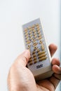 Hand holding a DVD remote Royalty Free Stock Photo