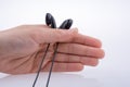 Hand holding earphone Royalty Free Stock Photo