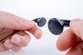 Hand holding earphone Royalty Free Stock Photo