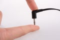 Hand holding earphone jack Royalty Free Stock Photo