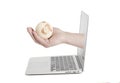 Hand holding earth globe coming from screen laptop Royalty Free Stock Photo