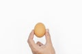 Hand holding egg, isolated on white background Royalty Free Stock Photo
