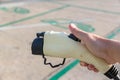 Hand holding Electric car charger. Electric Vehicle EV Charging station & Charger. Human hand is holding Electric Car Charging con Royalty Free Stock Photo