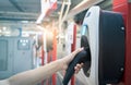 Hand holding electric plug-in charger at electric vehicle charging station. Commercial EV car charging point for charge EV battery Royalty Free Stock Photo