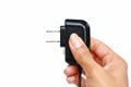 Hand holding Electric plug on white background Royalty Free Stock Photo