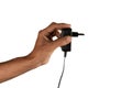 black male hand holding electric power plug Royalty Free Stock Photo