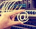 Hand holding email symbol over Network switch Royalty Free Stock Photo