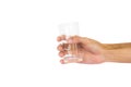 Hand holding empty glass isolated on white background with clipping path Royalty Free Stock Photo