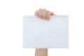 Hand holding an empty notepad (notebook) isolated