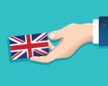 Hand holding England flag card with blue background. vector illustration eps10 Royalty Free Stock Photo