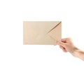 The hand holding the envelope. Close up. Isolated on white background Royalty Free Stock Photo