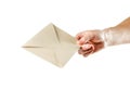 The hand holding the envelope. Close up. Isolated on white background Royalty Free Stock Photo