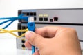Hand holding ethernet cable Royalty Free Stock Photo