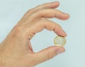 Hand holding euro coin Royalty Free Stock Photo