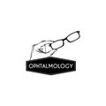 Hand holding eyeglasses. Ophthalmology inscription. Optics logo. Vector illustration.