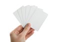 A hand holding a fan of blank playing or index cards Royalty Free Stock Photo