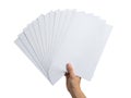 A hand holding a fan of white papers Royalty Free Stock Photo