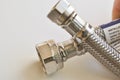Hand holding faucet connector Royalty Free Stock Photo