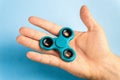 Hand holding fidget spinner