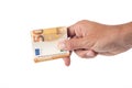 Hand holding a fifty euro banknote isolated on white background. Royalty Free Stock Photo