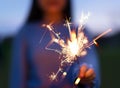 hand holding fire sparkles to celebrate the 4th of July Royalty Free Stock Photo