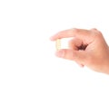 Hand holding fish oil medicine Royalty Free Stock Photo