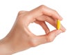 Hand holding Fish oil softgel capsules on white background. Omega 3 dietary supplement