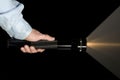 Hand holding flashlight Royalty Free Stock Photo