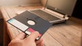 Floppy Disk and Notebook on wooden board Royalty Free Stock Photo