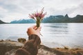 Hand holding flowers bouquet foggy mountains landscape Travel lifestyle Royalty Free Stock Photo