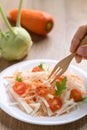 Salad with sliced kohlrabi, carrot, tomato and mizuna leaf