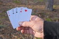 hand holding four playing cards with deuces Royalty Free Stock Photo