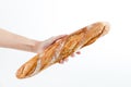 Hand holding a French baquette bread Royalty Free Stock Photo