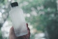 Hand holding fresh cool water bottle Royalty Free Stock Photo