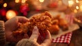 A Hand Holding Fried Chicken.AI generated image Royalty Free Stock Photo